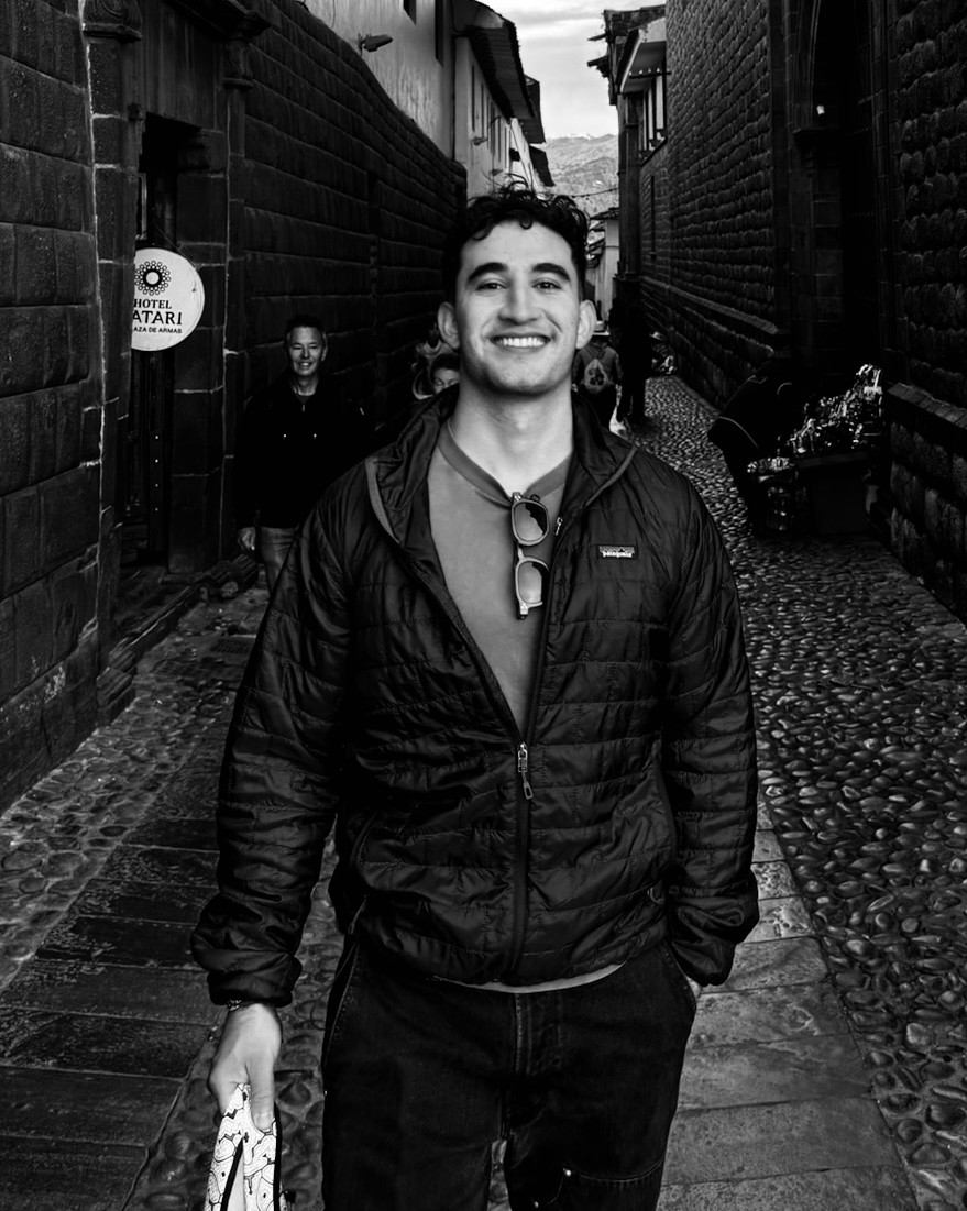 Diego Cordova on a cobblestone street in Cusco